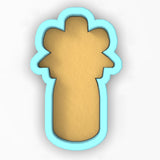 a cookie shaped like a cross on a white background