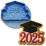a cookie cutter with a graduation cap on top of it