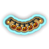 a string of halloween lights with jack - o'- lanterns on them