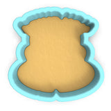 a cookie cutter with a cookie in the shape of a bear
