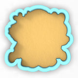 a cookie shaped like a frame with a blue border