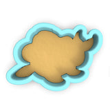 a cookie cutter with a cookie shaped like a fish