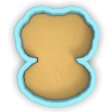 a cookie cutter with a cookie in the shape of a cookie