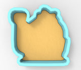 A cookie cutter in the shape of a camel, with a light brown color.