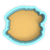 a cookie cutter with a cookie in the shape of a bear