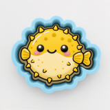A cheerful yellow pufferfish with a smiling face, surrounded by a blue border, is depicted in the image.