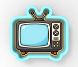 A cartoon-style television set with a blue and white color scheme, featuring a screen, antennae, and control buttons.
