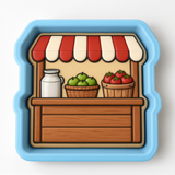 A blue and white toy store display with various items, including a milk jug, baskets of fruit, and a wooden shelf.