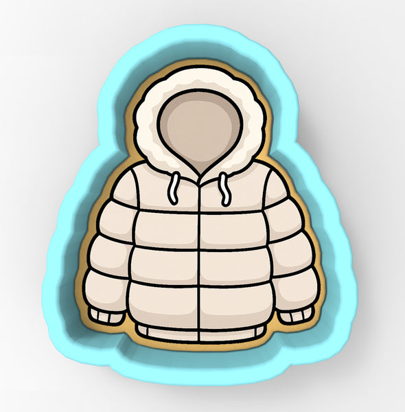 A cookie cutter in the shape of a winter coat with a hood.