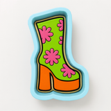A colorful, cartoon-style shoe with a floral pattern on it.