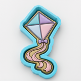 A colorful, diamond-shaped cookie cutter in the shape of a kite.