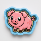 A pink pig cookie cutter with a blue border.