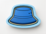 A blue bucket hat-shaped cookie cutter is shown against a white background.