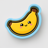 A cartoon banana with a smiling face and a blue outline.