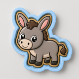 A cartoon donkey cookie cutter with a blue outline and a brown and white color scheme.