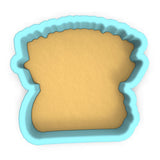 a cookie cutter shaped like a piece of bread