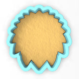 a cookie cutter shaped like a flower on a white background