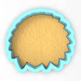 a cookie cutter with a cookie in the shape of a hedge