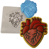 a cookie cutter with a heart and a stencil