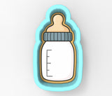 A baby bottle cookie cutter in a blue and yellow color scheme.