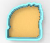 A cookie cutter in the shape of a heart, with a light yellow background.
