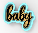 A blue and gold cookie cutter with the word "baby" written on it.
