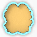 a cookie shaped like a frame with a blue border