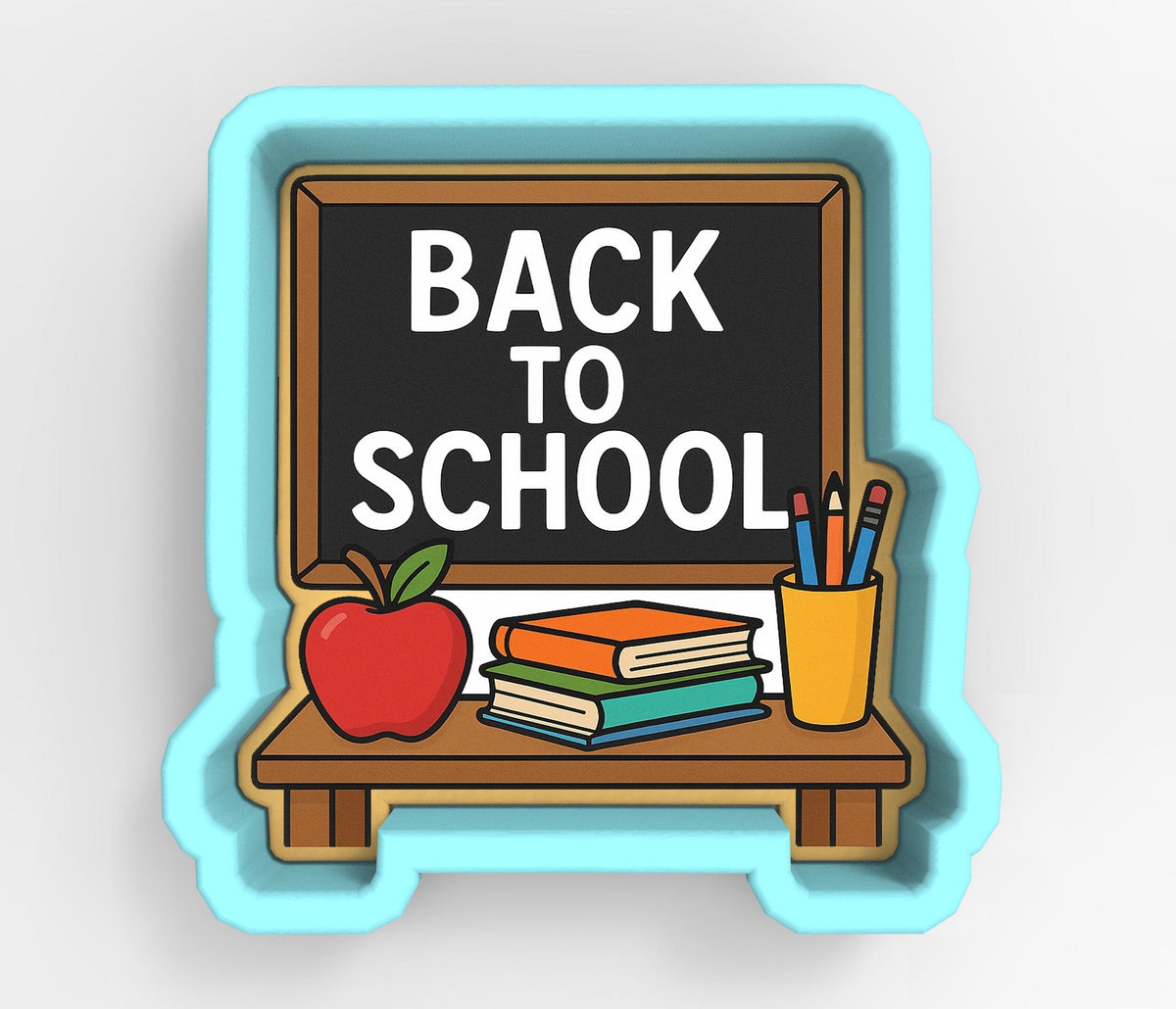 A blue cookie cutter shaped like a chalkboard with the text "BACK TO SCHOOL" written on it, along with various school supplies such as books, pencils, and an apple.