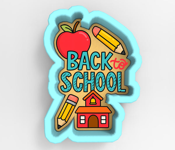 The image is a cookie cutter-shaped design featuring various school-related items such as an apple, pencils, and a schoolhouse, with the text "BACK to SCHOOL" prominently displayed.