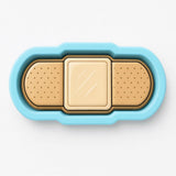 A blue and beige toy with a bandage-like shape, designed to resemble a medical device or toy for children.