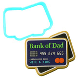 a cookie shaped like a credit card next to a cookie cutter
