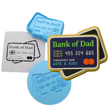 a bank of dad credit card cookie next to a cookie cutter