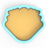 a cookie cutter with a cookie in the shape of a heart