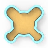 a cookie shaped like a cross on a white background