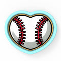 a heart shaped object with a baseball inside of it