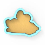 a cookie shaped like a cloud on a white background