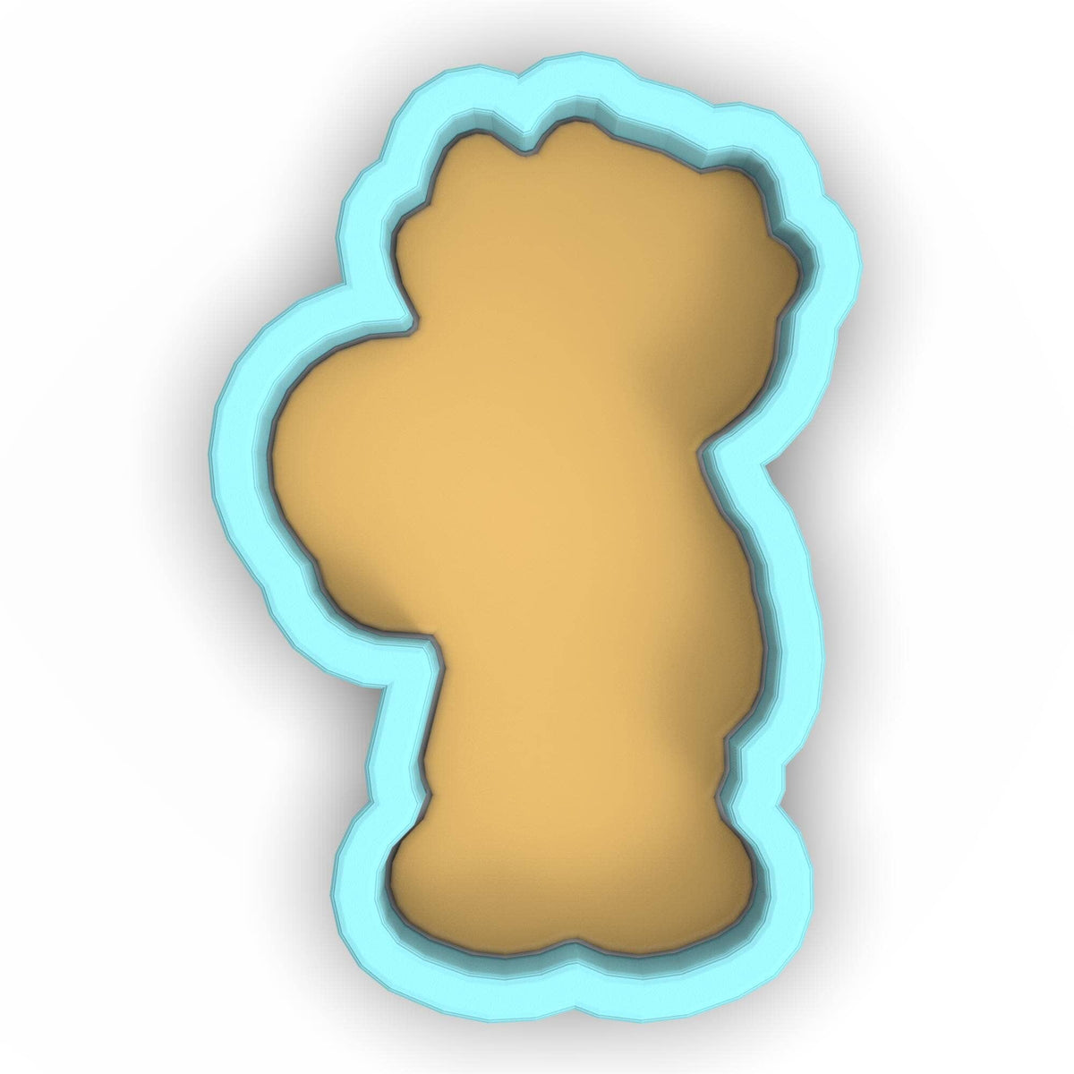 a cookie cutter with a cookie shaped like a bear
