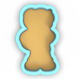 a cookie shaped like a teddy bear on a white background