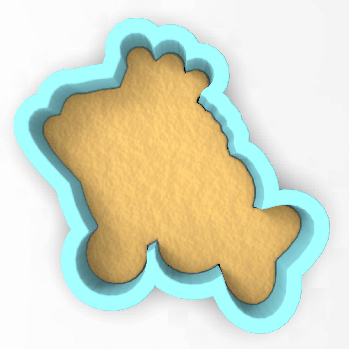 a cookie cutter with a cookie shaped like a bear