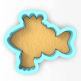 a cookie cutter shaped like a fish