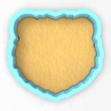 a cookie cutter with a cookie in the shape of a heart