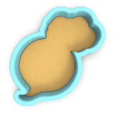 a cookie cutter with a cookie in the shape of a dog