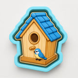 A birdhouse in the shape of a cookie cutter, with a blue roof and a small blue bird perched on the front.
