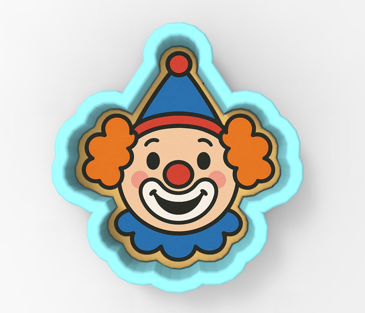 A blue cookie cutter shaped like a clown's face with orange ears and a red nose.