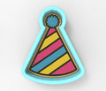 A colorful party hat cookie cutter with a blue pom pom on top.