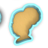 a cookie cutter with a silhouette of a woman's head