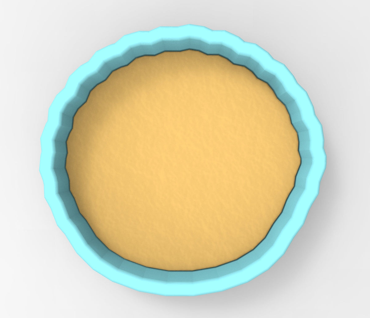 A blue-rimmed bowl filled with a yellow substance, likely a batter or dough, is shown in the image.