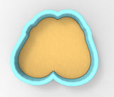 A heart-shaped cookie cutter with a blue border.