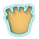 a cookie cutter with a cookie in the shape of a crown