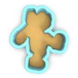 a cookie shaped like a teddy bear on a white background